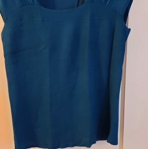 Teal short sleeved dressy knit with boxy neckline. Sort gentle knit